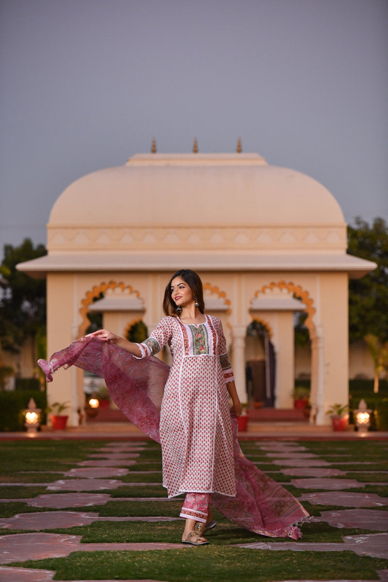 An artistic pink handblock cotton kurta set with Lace detail