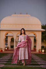 An artistic pink handblock cotton kurta set with Lace detail